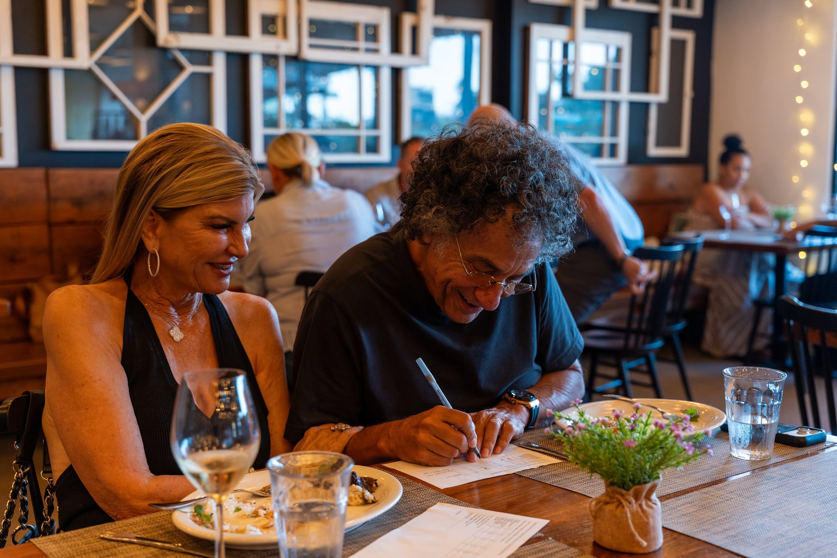 Guests enjoying dinner at Baker and Wife